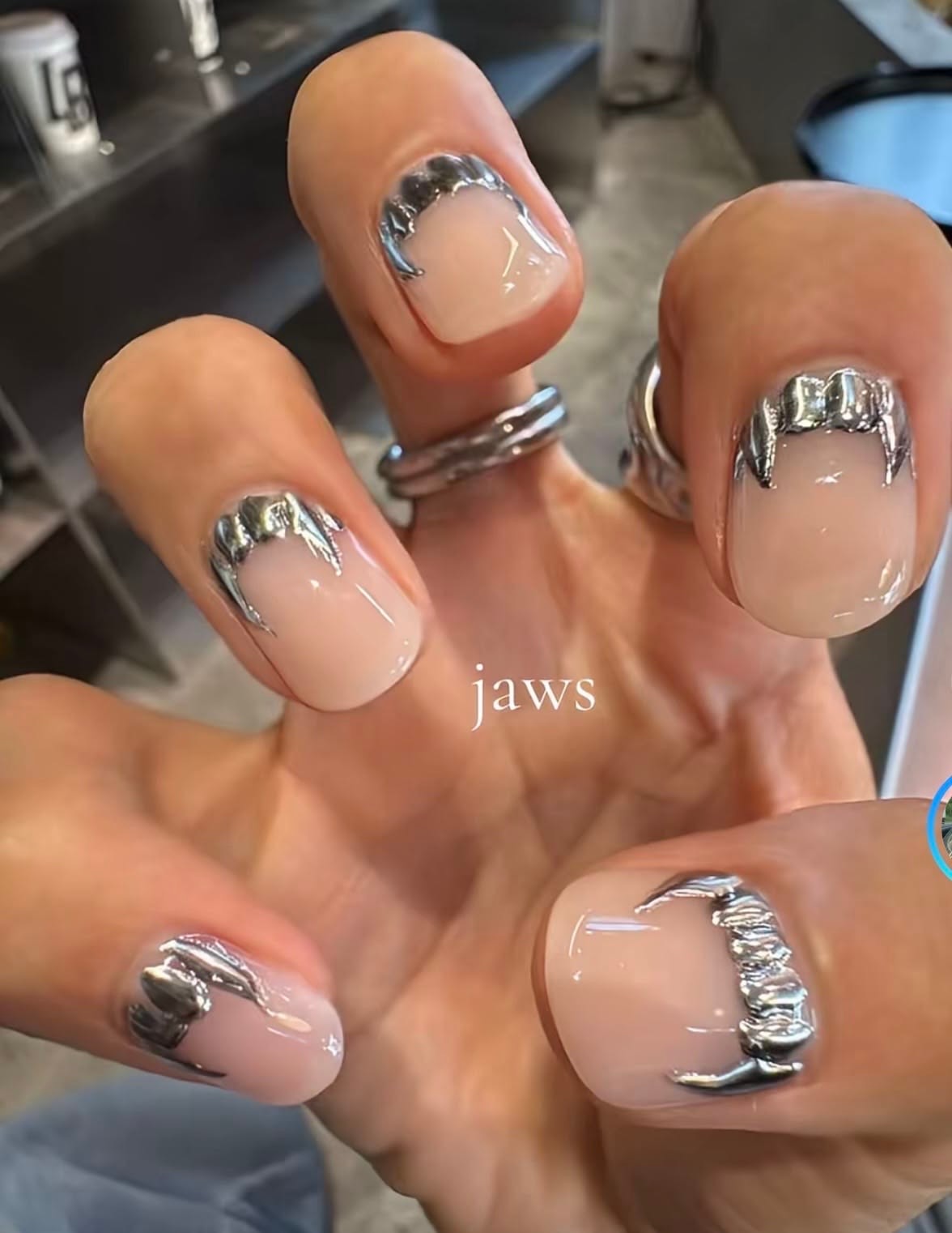 Nude nails with silver metallic accents